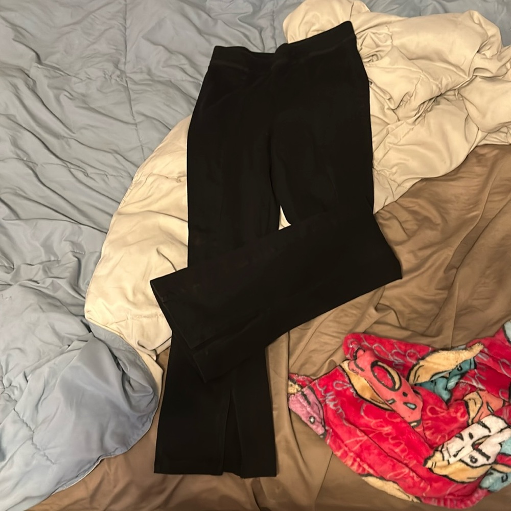 tight fitted black leggings with slits at the bottom